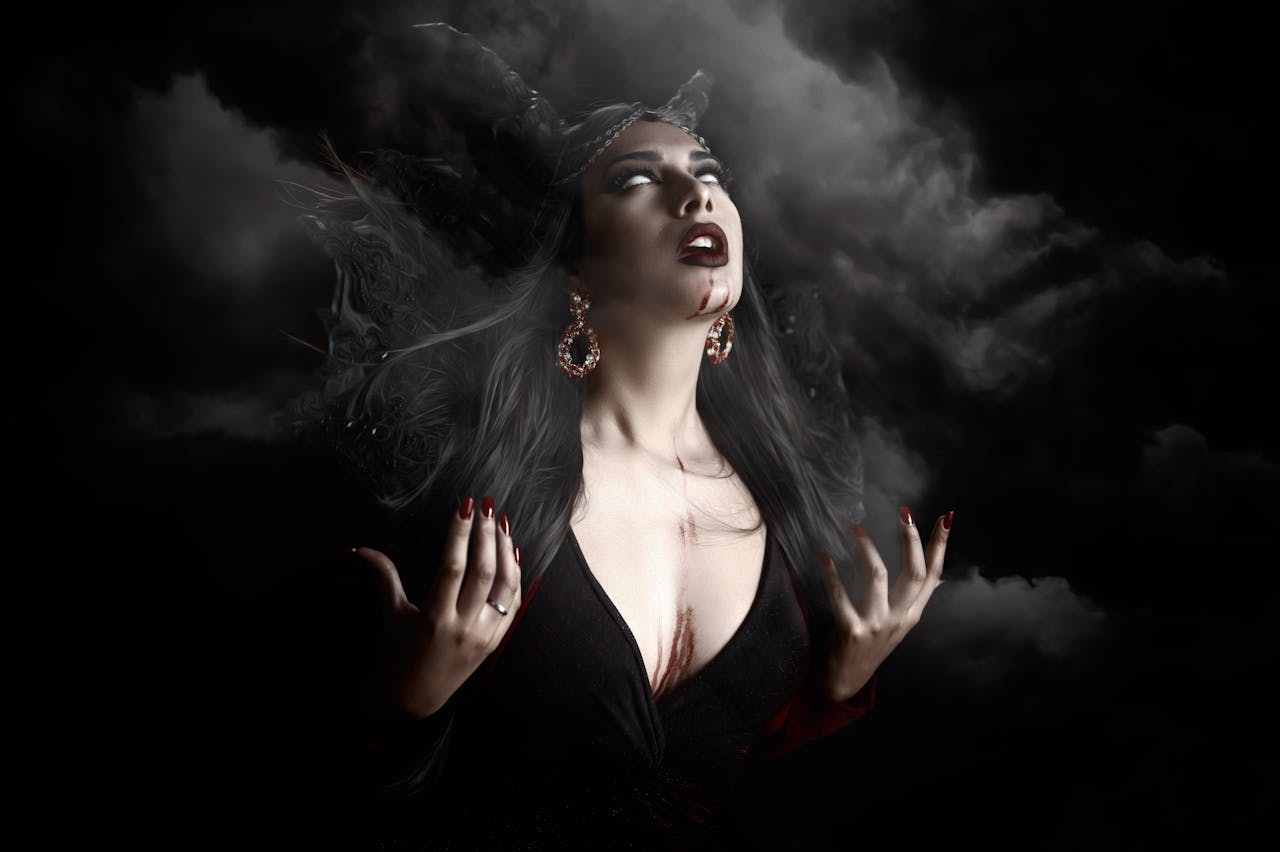 Menu Eerie portrayal of a vampire woman with dramatic lighting and smoke.